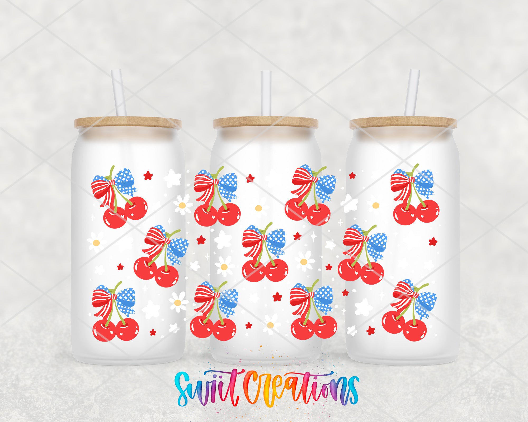 three white glass tumblers with patriotic designs, including cherries, stars, and stripes, as well as a straw lid.
