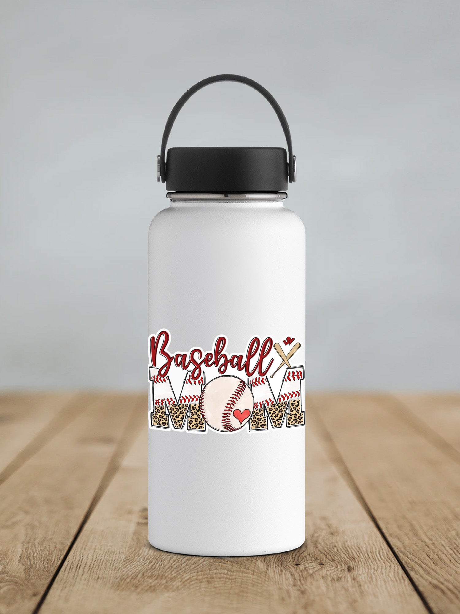 a white water bottle with a black lid on a wooden table