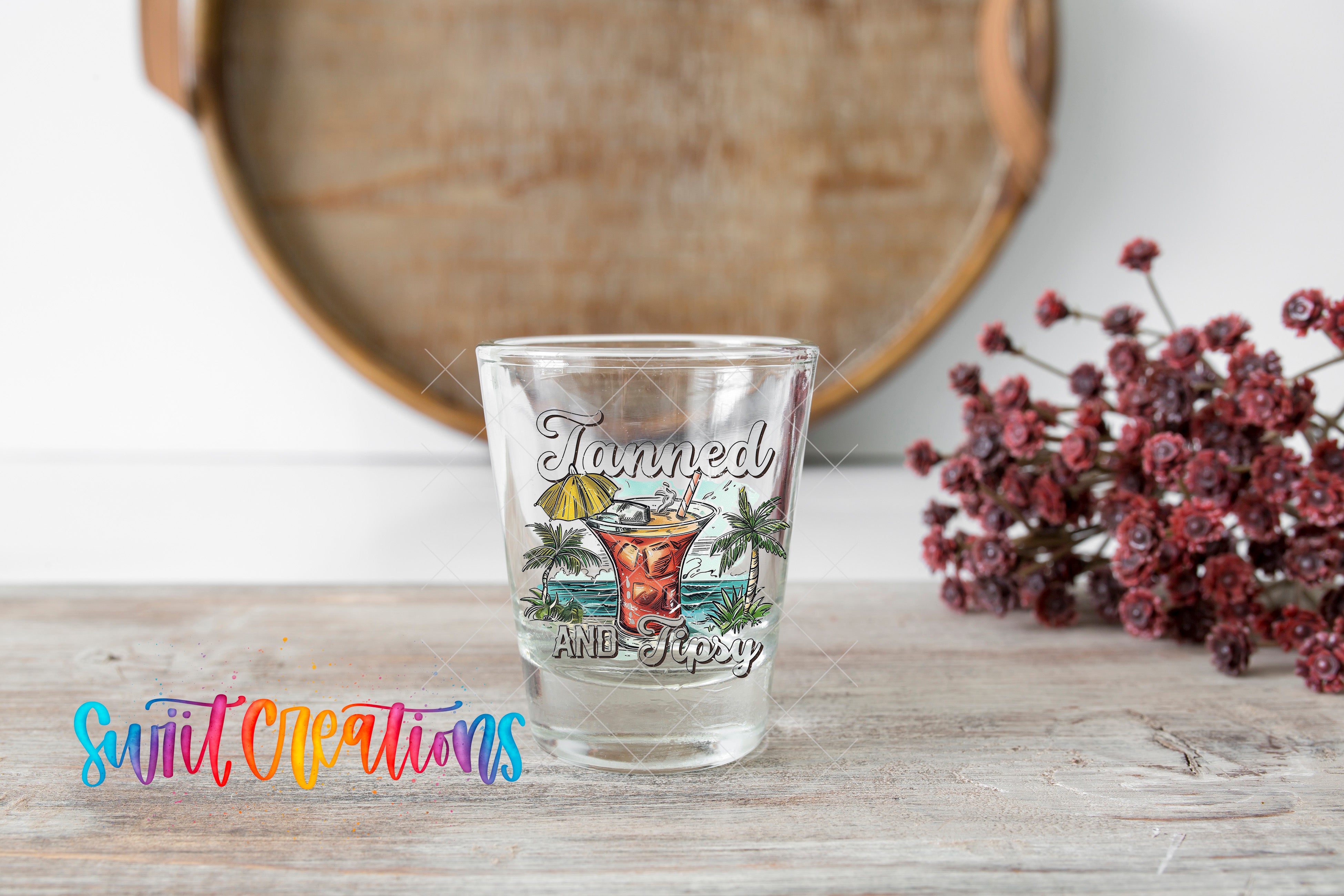a shot glass sitting on top of a wooden table