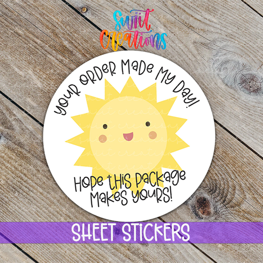 a sticker with a sun on it on a wooden surface