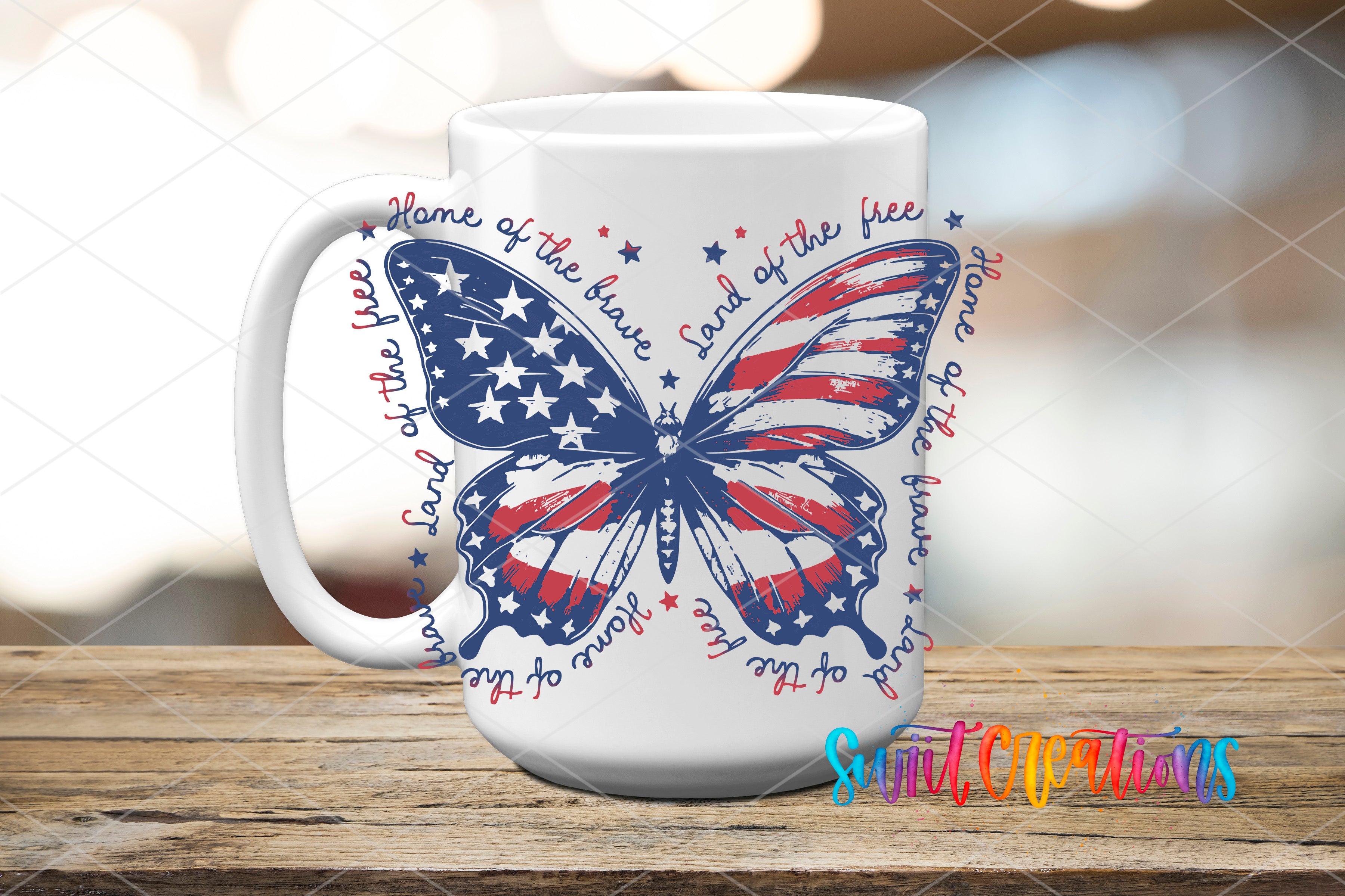 A white ceramic mug with a patriotic design featuring a butterfly and stars, along with the text "Home of the free" and "Land of the free" written around it.