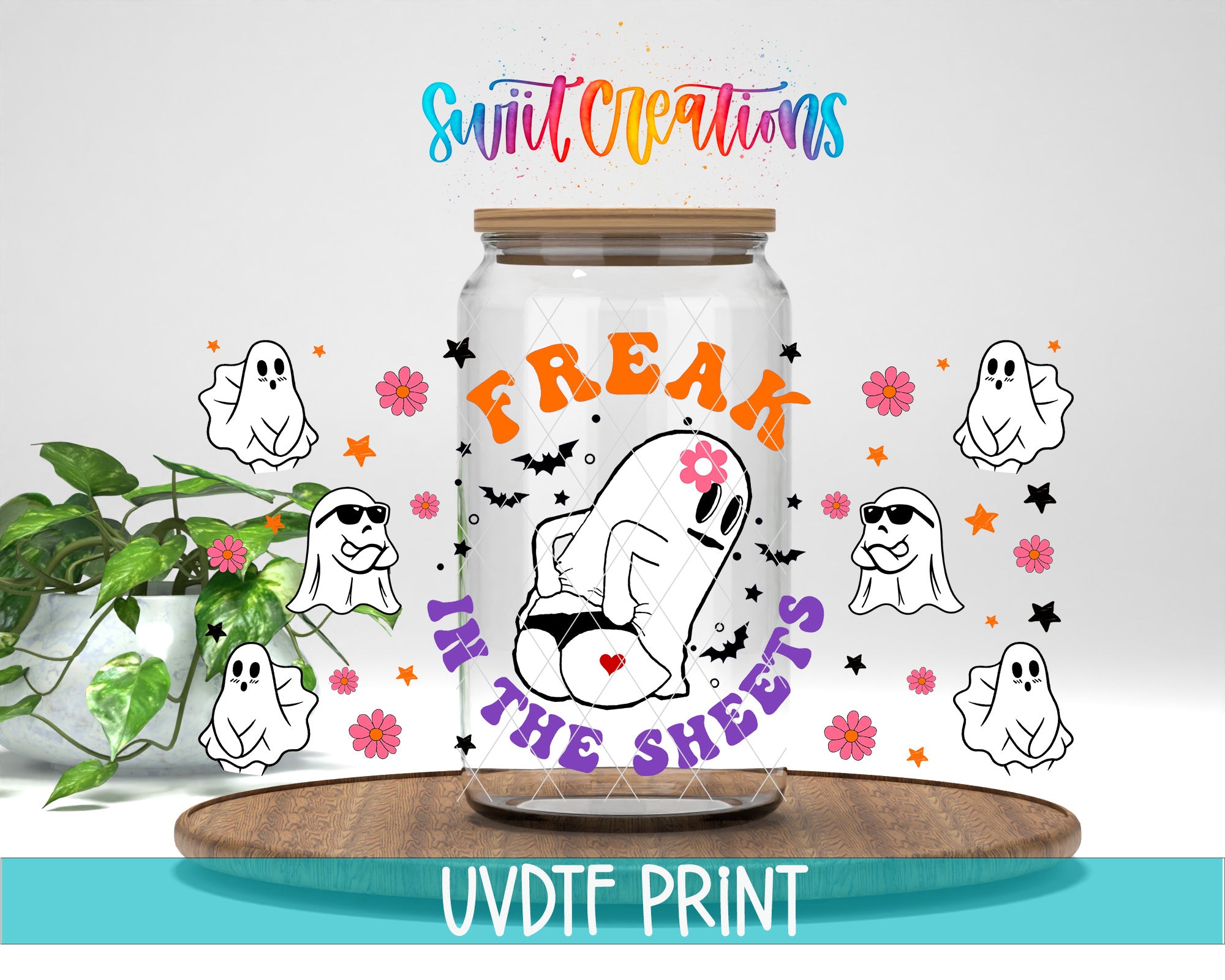 a glass jar with a cartoon ghost and the text "FREAK IN THE SHEETS" printed on it, surrounded by various ghost-related graphics and flowers.