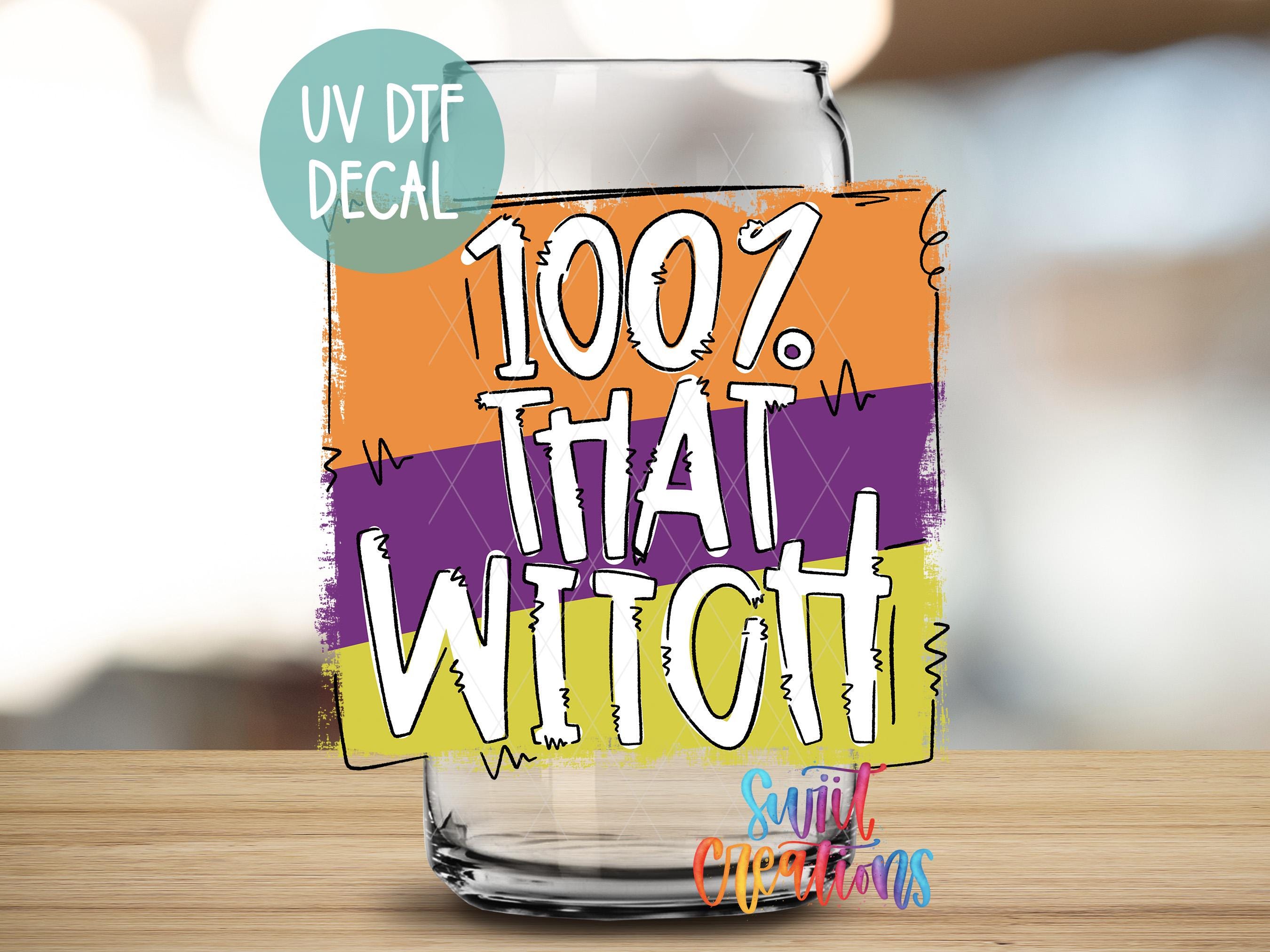 a glass with a sticker that says, 100 % that witch