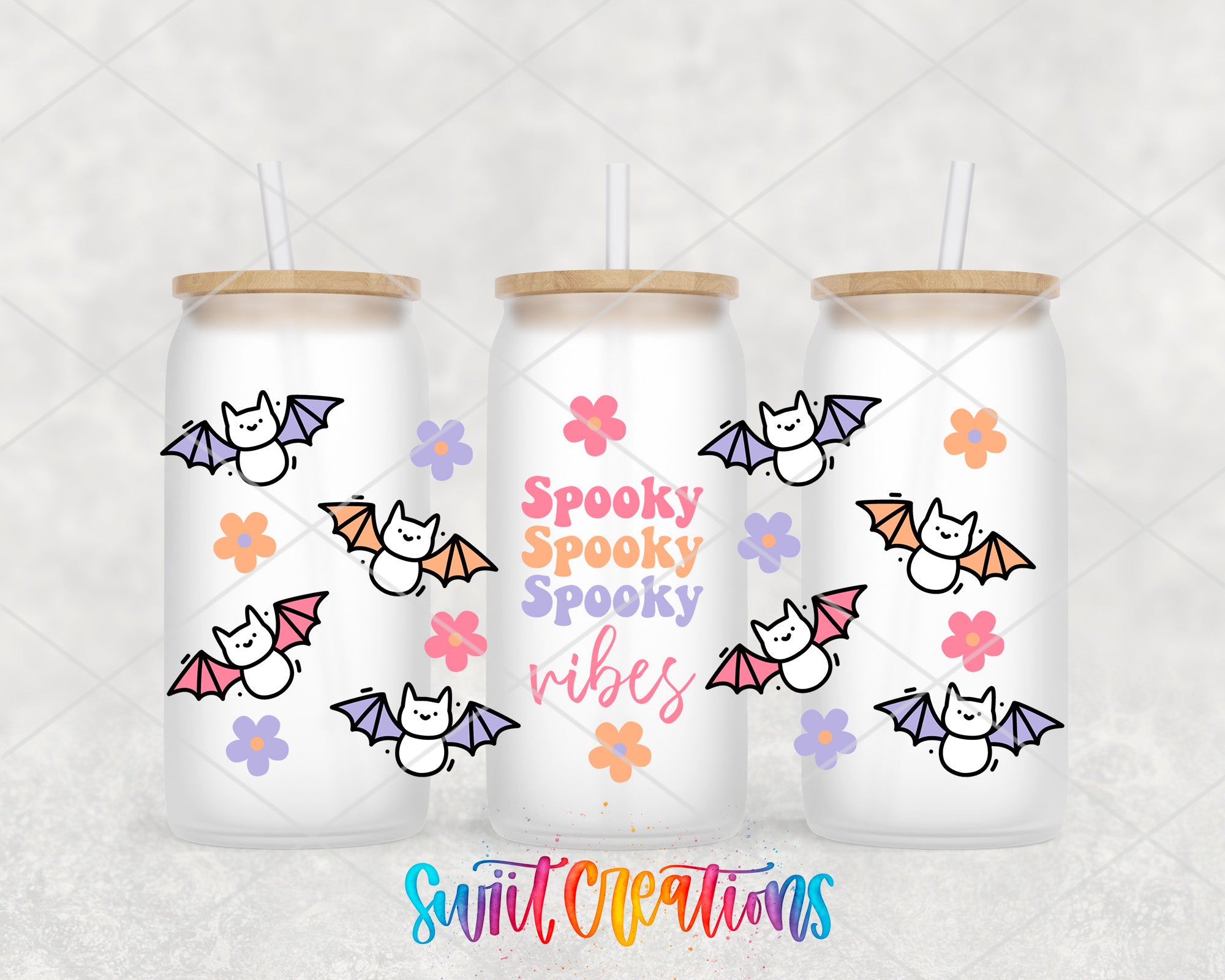 three white tumblers with a spooky bat design and the text "Spooky Spooky Vibes" printed on them.