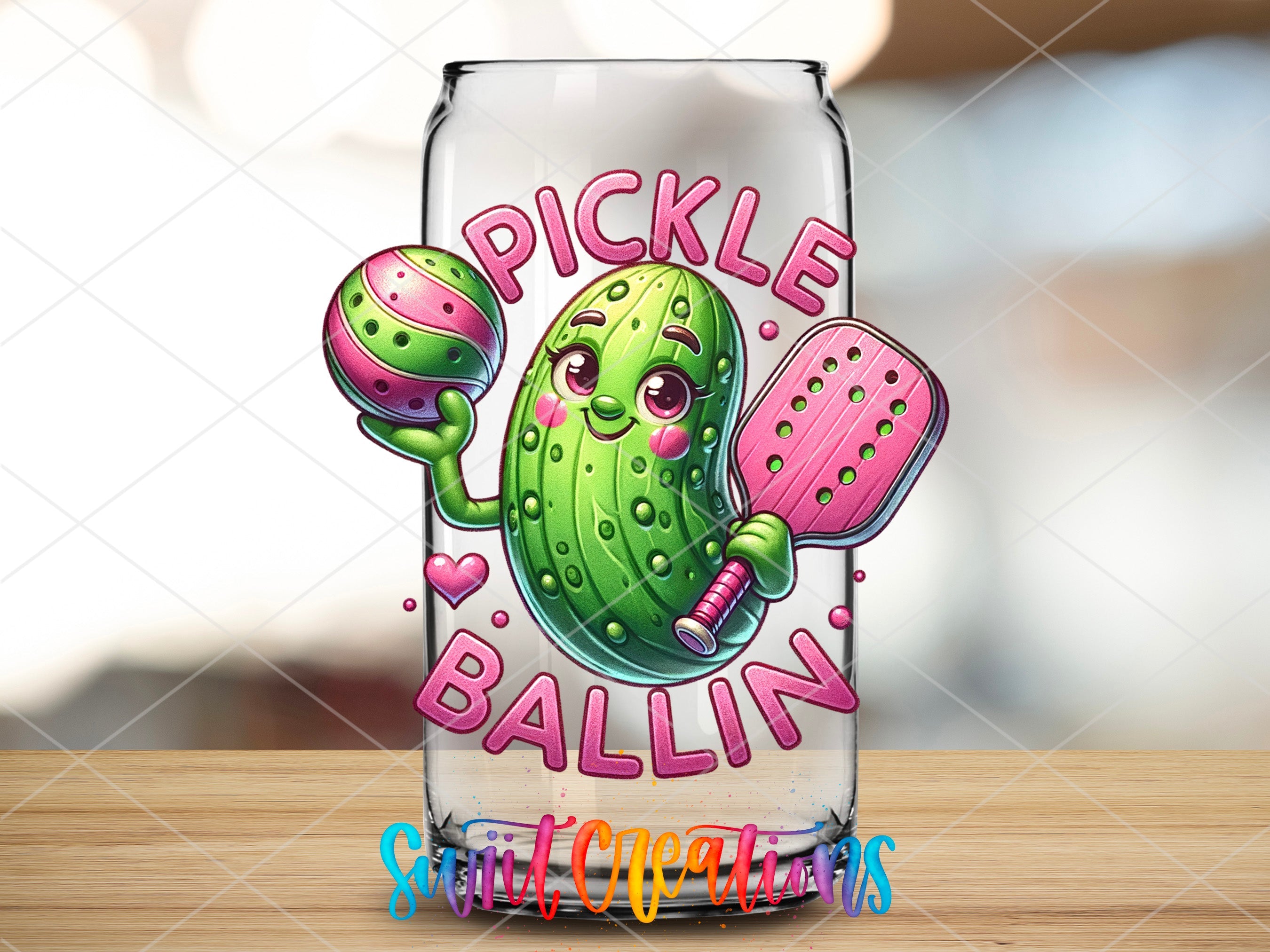 a glass with a pickle ballin design on it