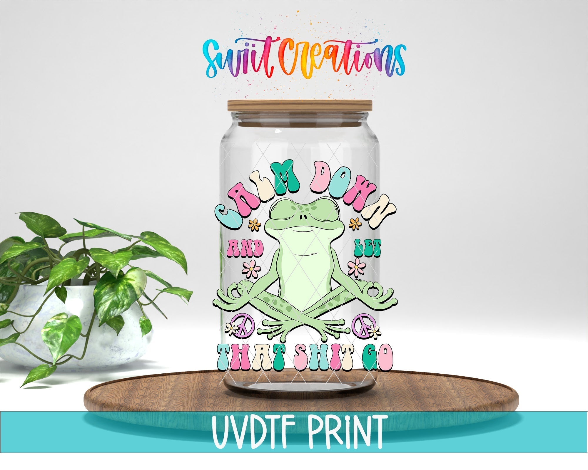 a glass jar with a frog sitting on top of it