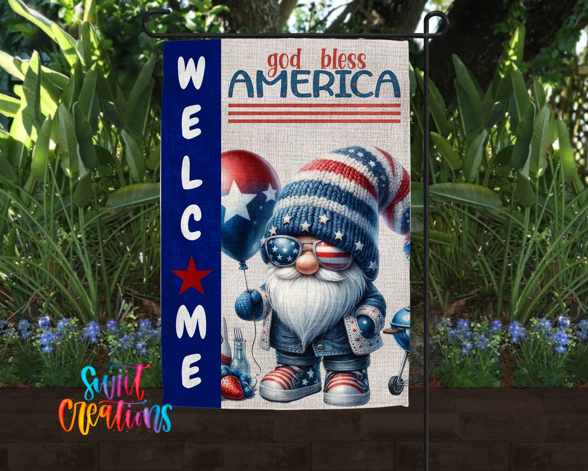 a patriotic welcome sign with a gnome holding balloons and sunglasses, surrounded by greenery and flowers.
