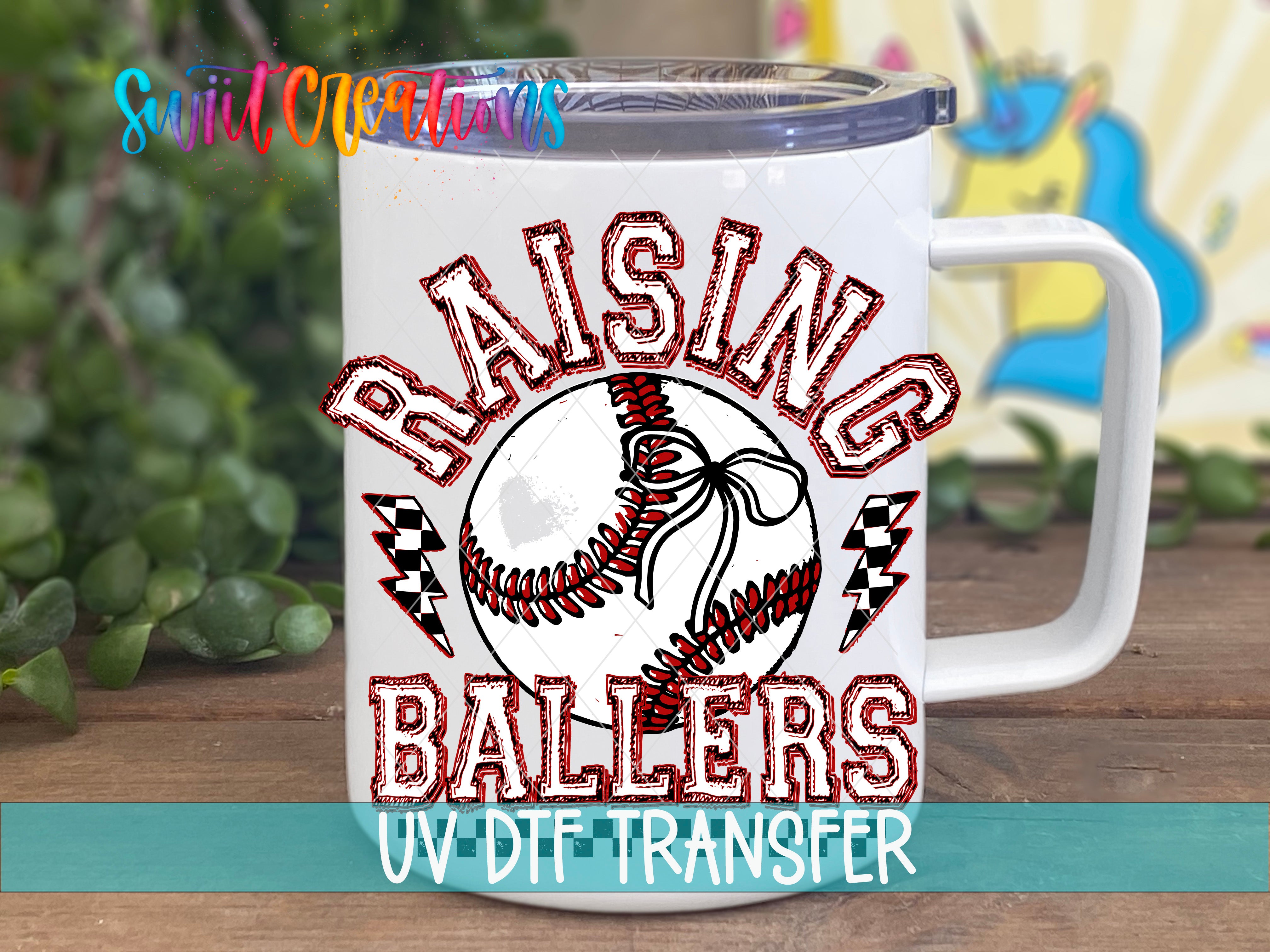 A white mug with a baseball design and the text "RAISING BALLS" printed on it.