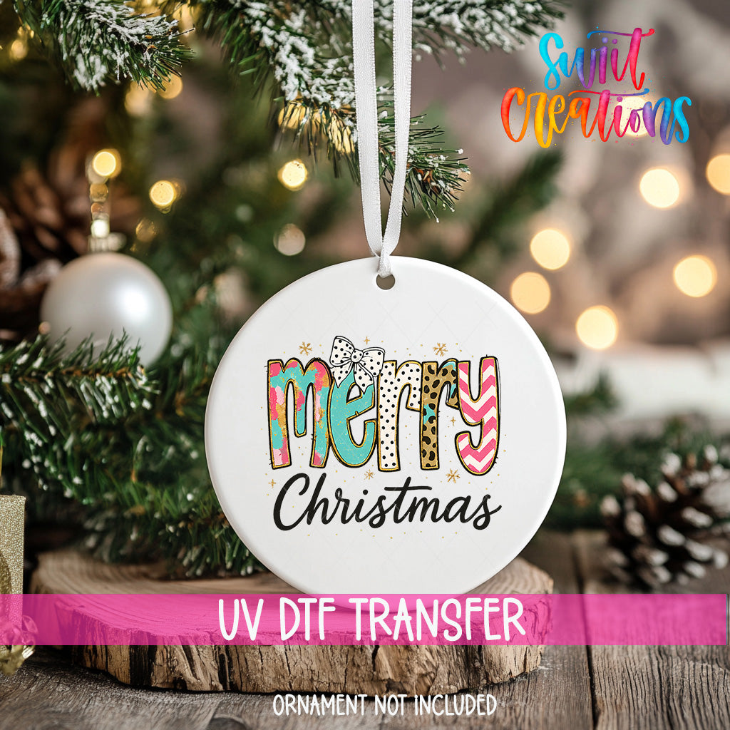 A white Christmas ornament with the text "Merry Christmas" printed on it, hanging from a tree branch.