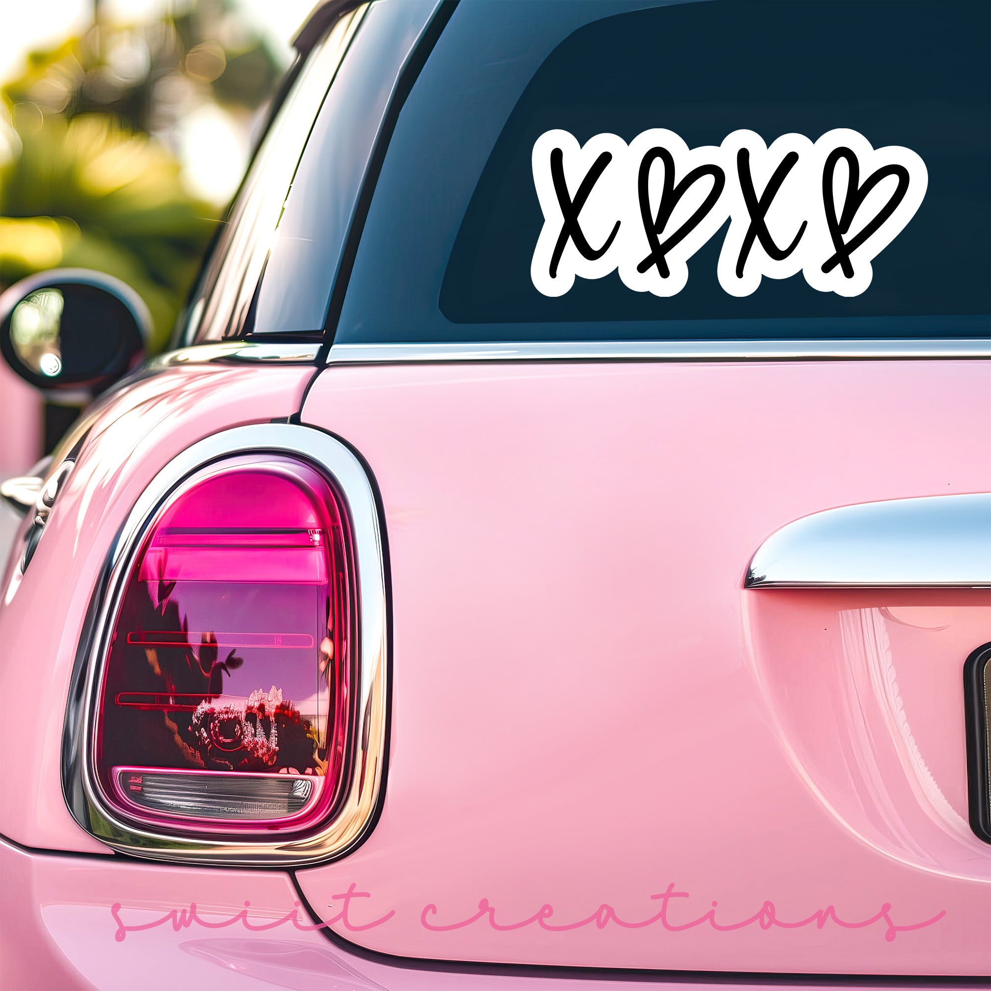 a pink car with a sticker that says xox