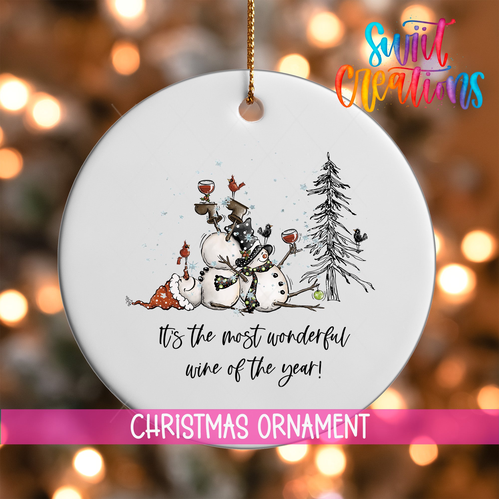 A white Christmas ornament with a snowman, a bird, and a tree, along with the text "It's the most wonderful wine of the year!"