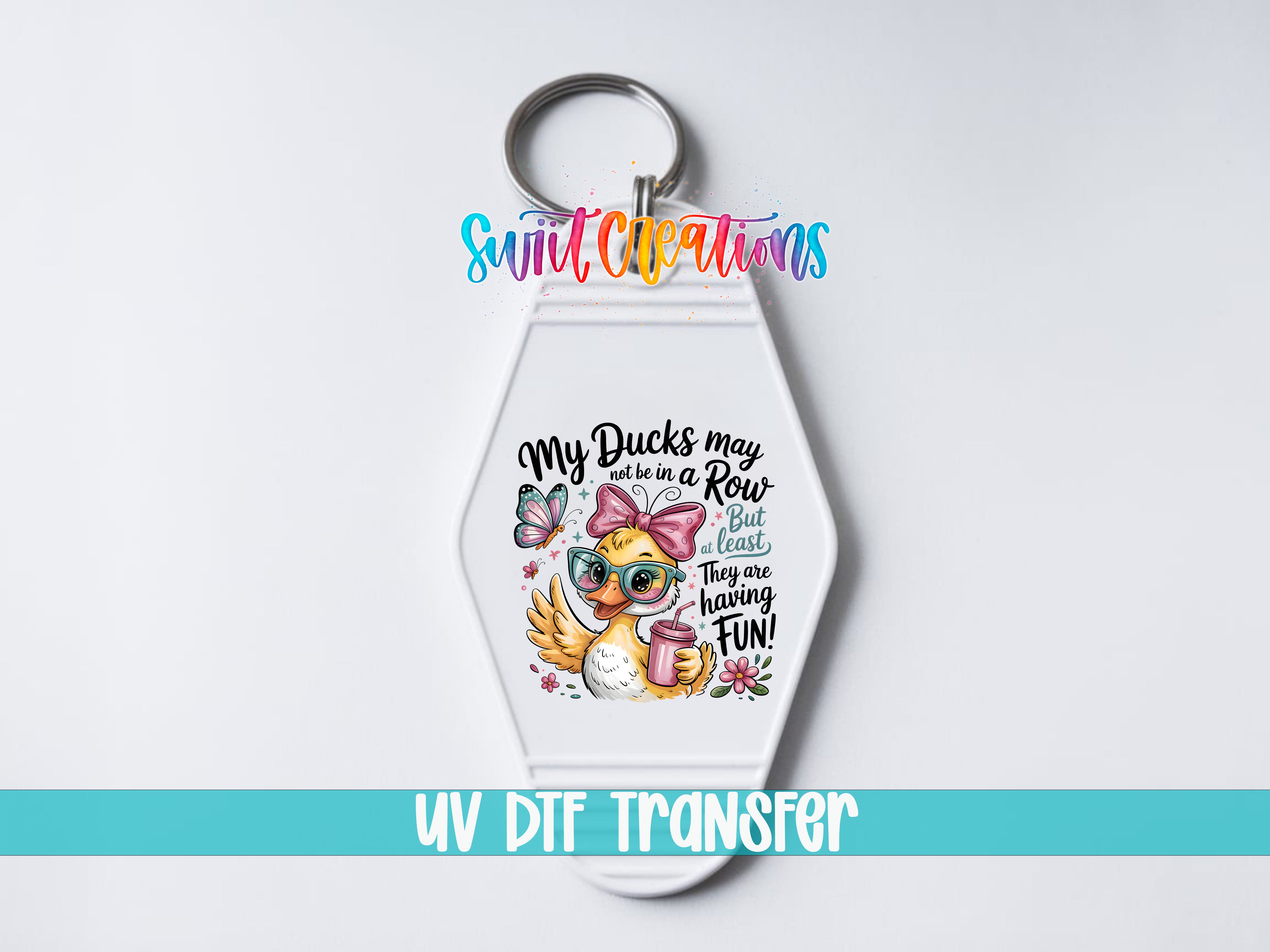 A keychain with a cartoon duck and text that says "My ducks may not be in a row but they are the best they are living fun!"