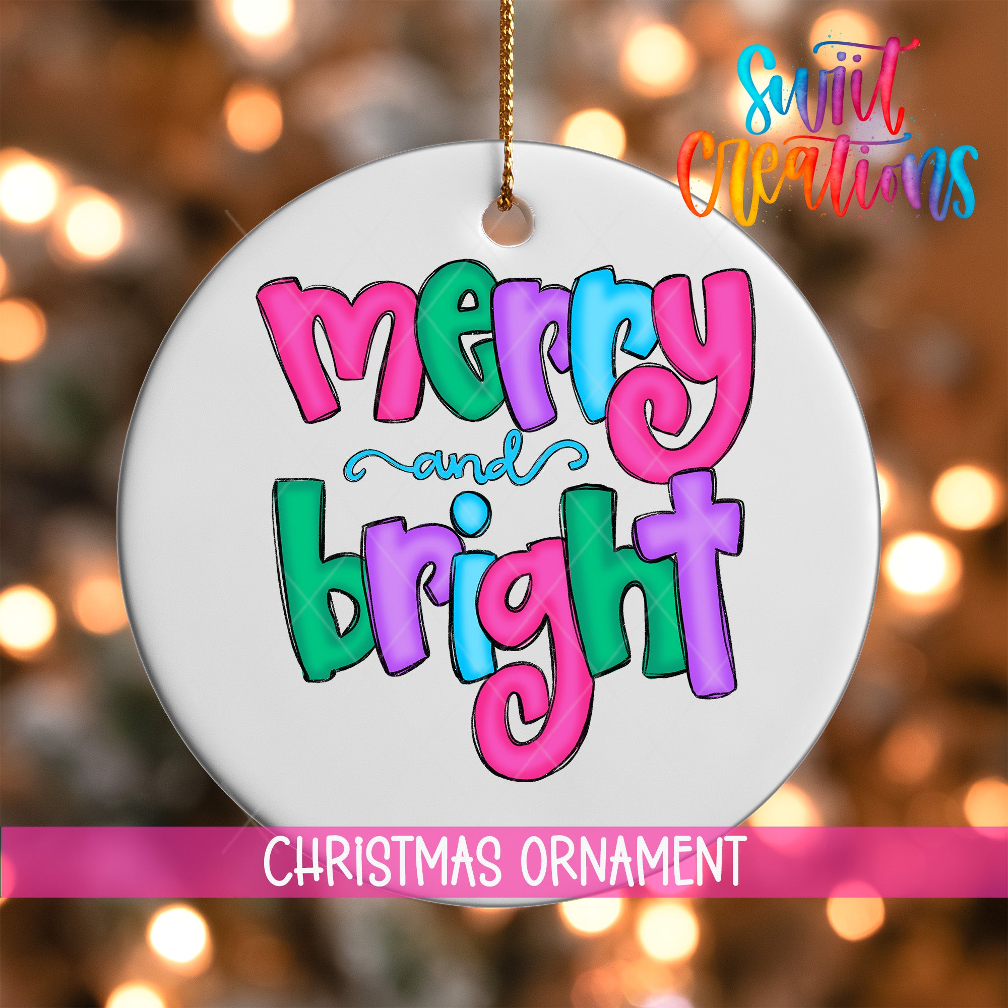 A white Christmas ornament with the text "merry and bright" in colorful letters.