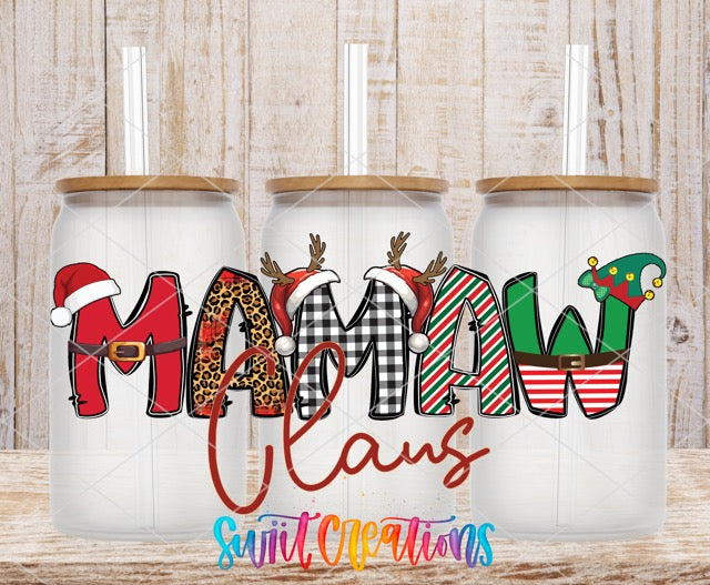 a couple of christmas mugs sitting on top of a wooden table