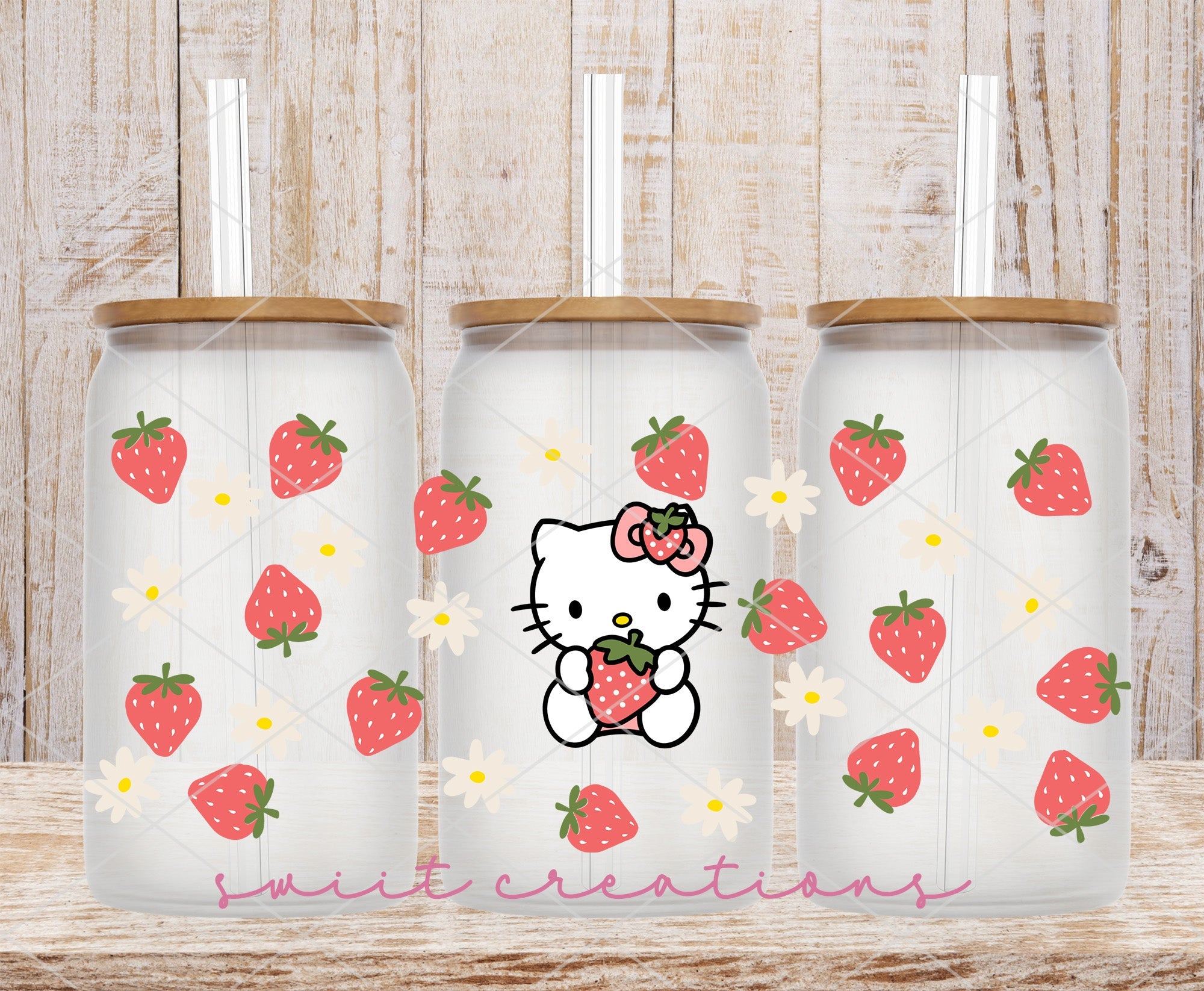 two hello kitty tumblers with strawberries on them