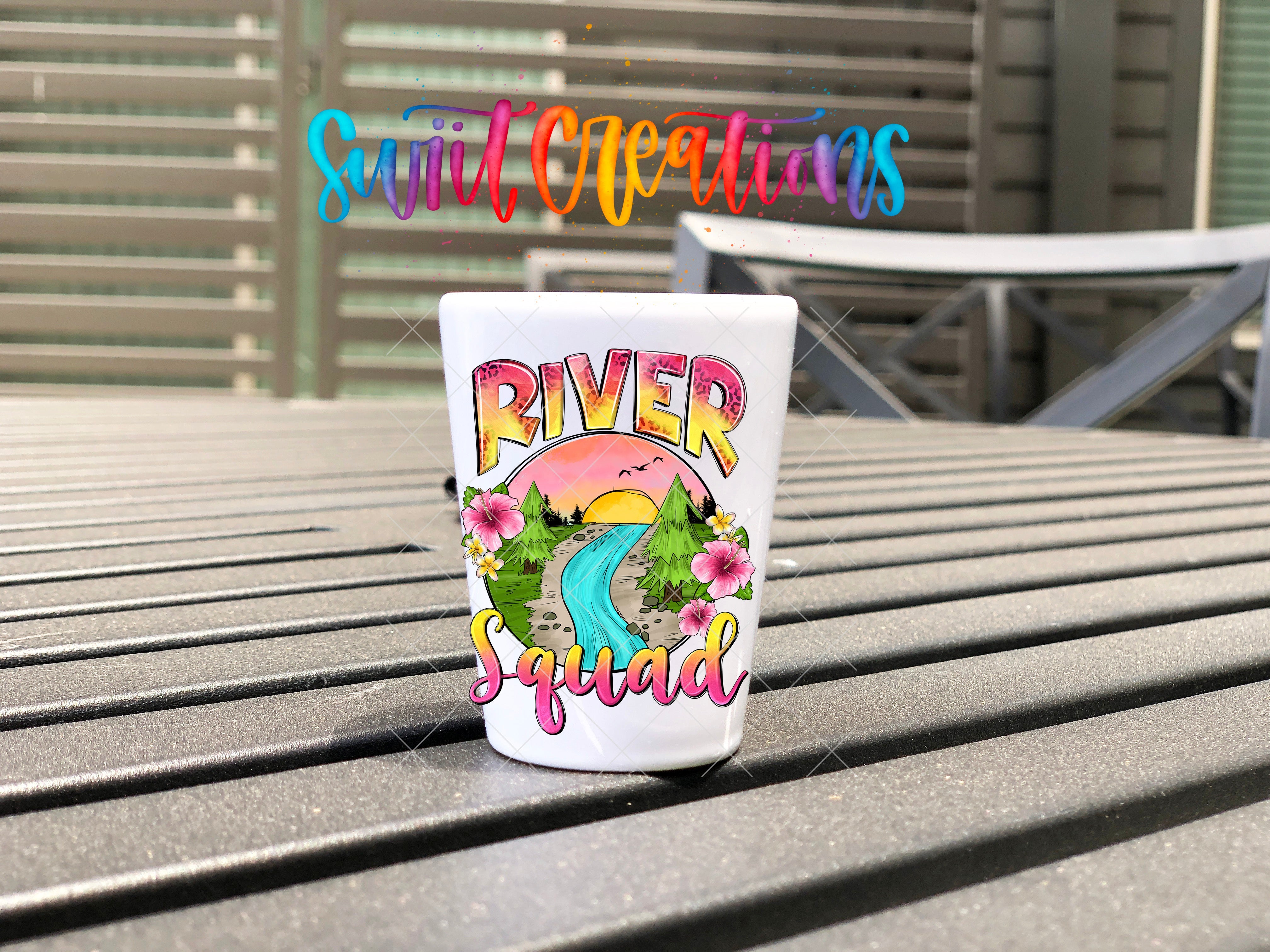 a plastic cup sitting on top of a wooden table