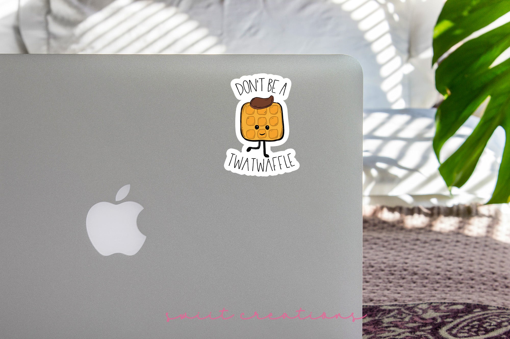 a laptop with a sticker on it sitting on a table