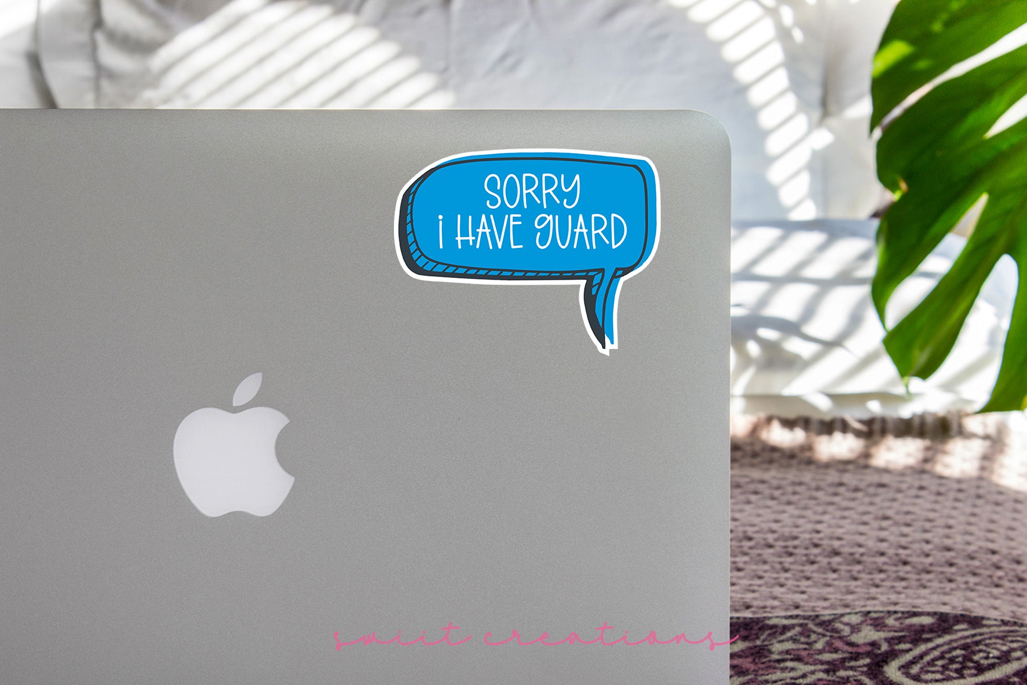 a laptop with a speech bubble sticker on it