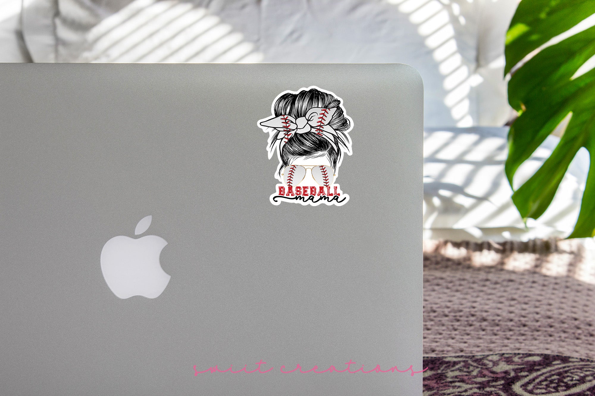 a laptop with a sticker of a woman's head