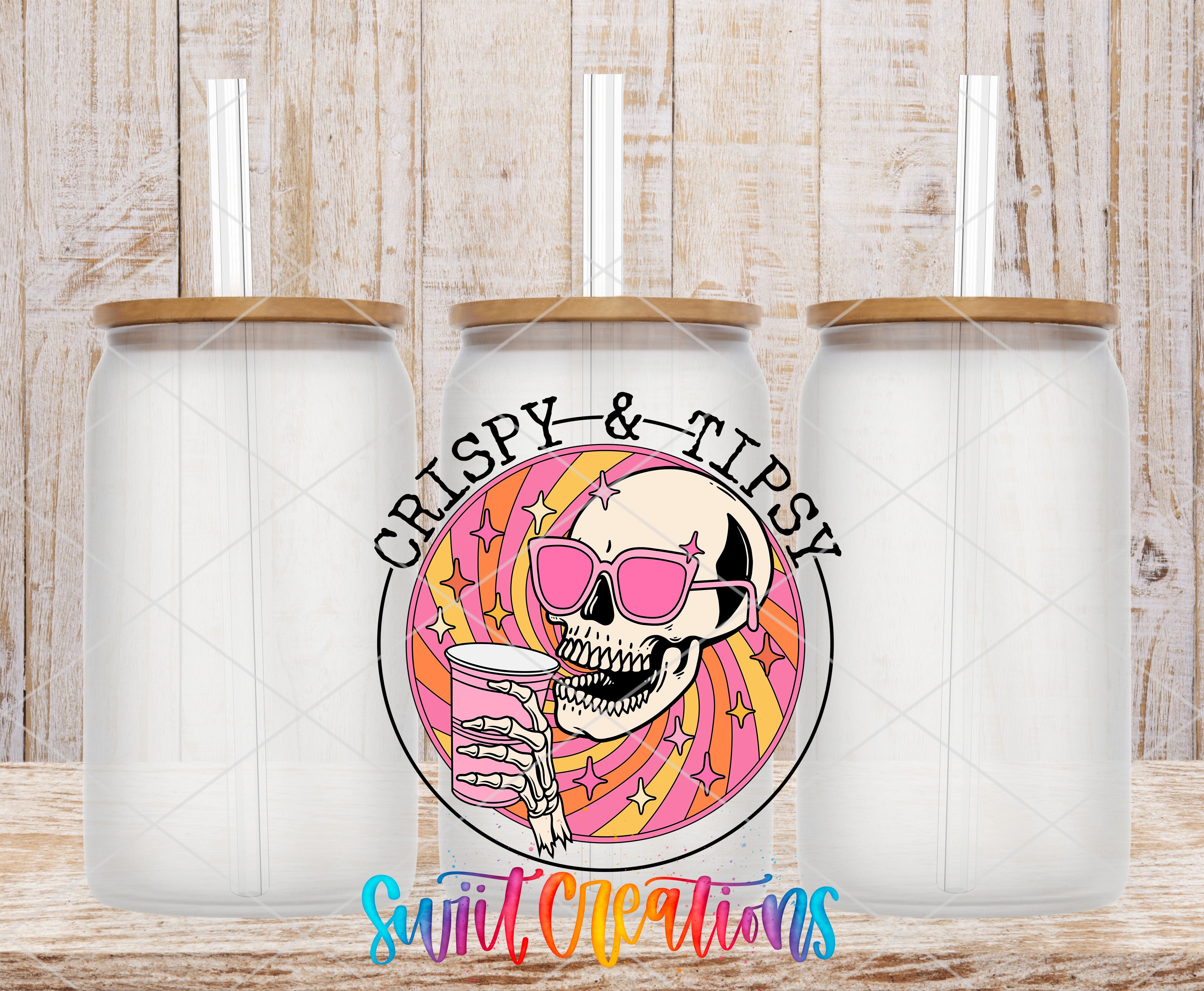 three clear glass jars with wooden lids, each with a straw sticking out of the top. In the center of the image, there is a colorful illustration of a skull wearing sunglasses and holding a drink, surrounded by a rainbow-colored design. The text "CRISPY & TIPSY" is written above the illustration, and "Swift Creations" is written below it.