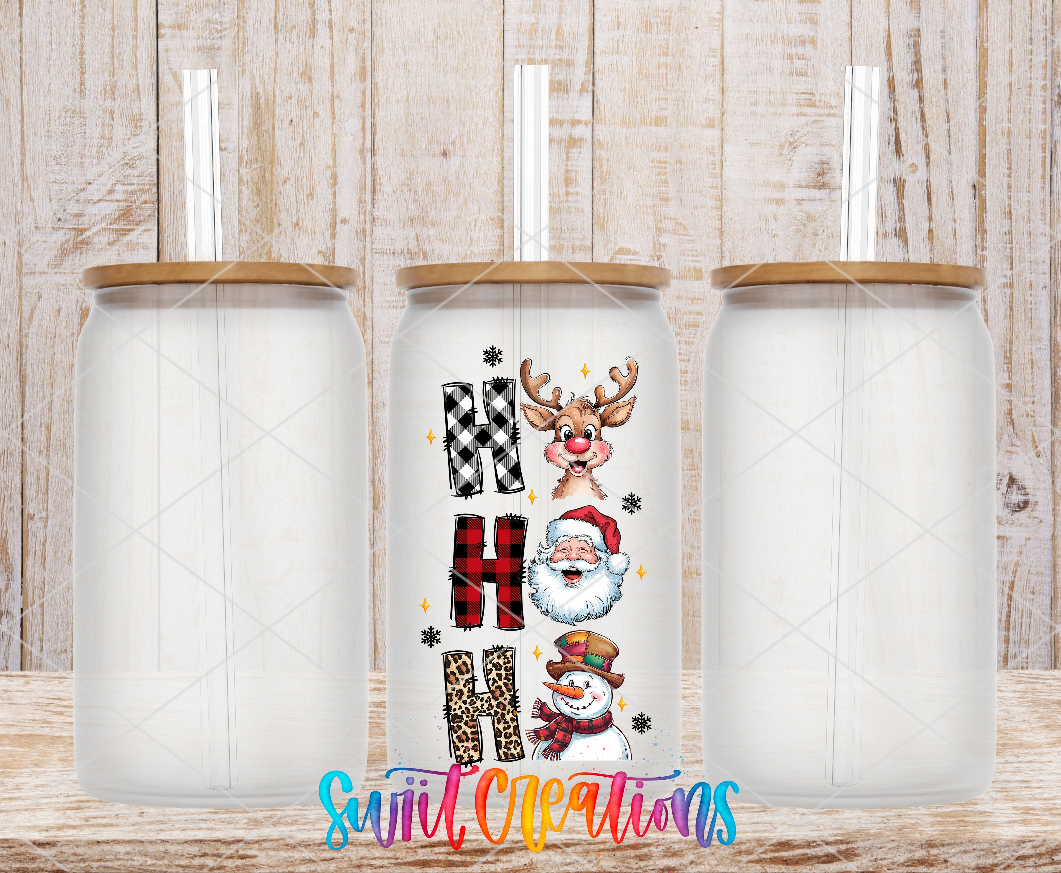 A collection of three glass jars with straws, each featuring a unique design and text. The jars are arranged in a row, with the middle jar having a design that includes a snowman, Santa Claus, and a leopard print.