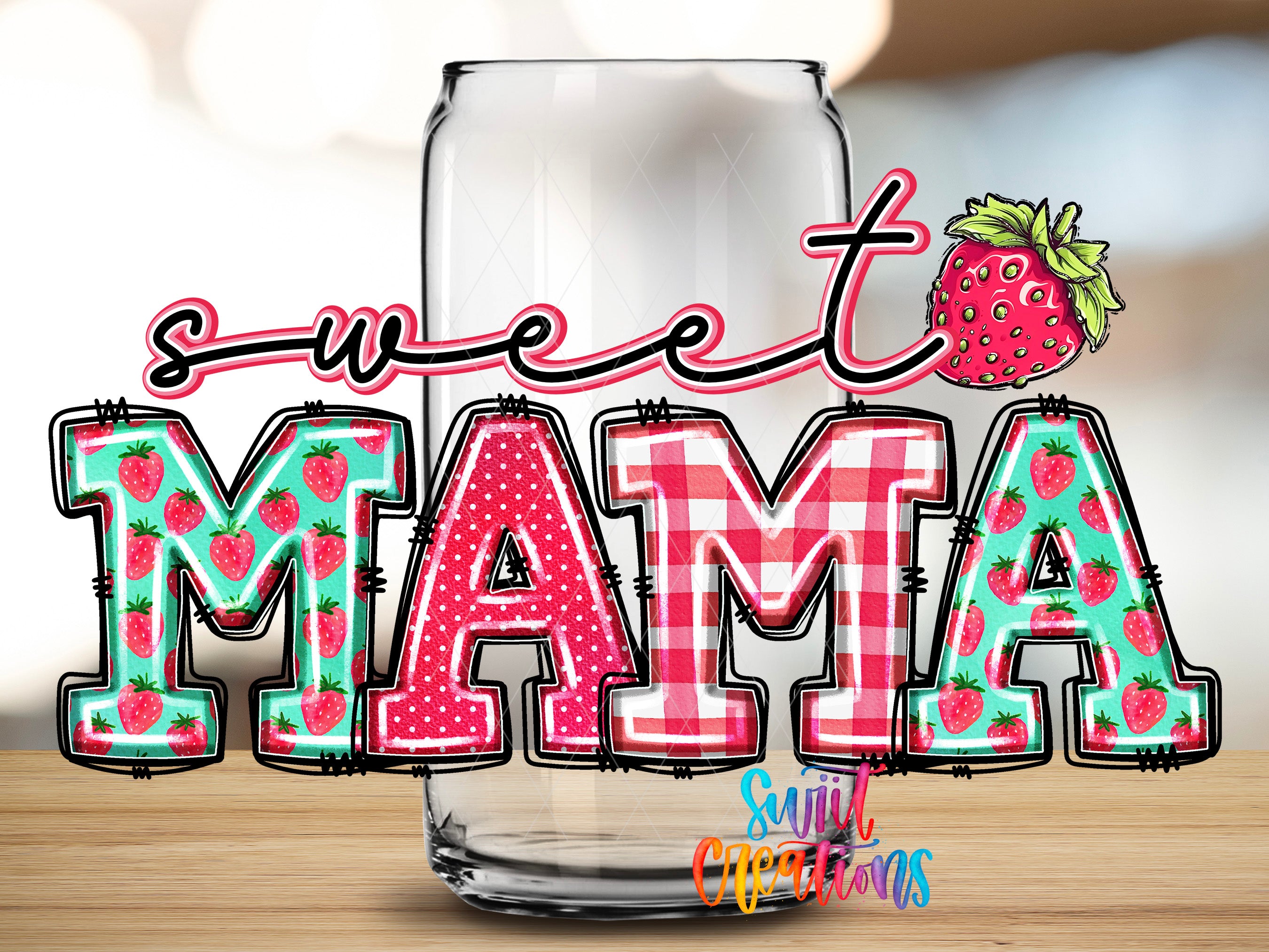 a glass with the word "MAMA" written on it, along with a strawberry graphic.