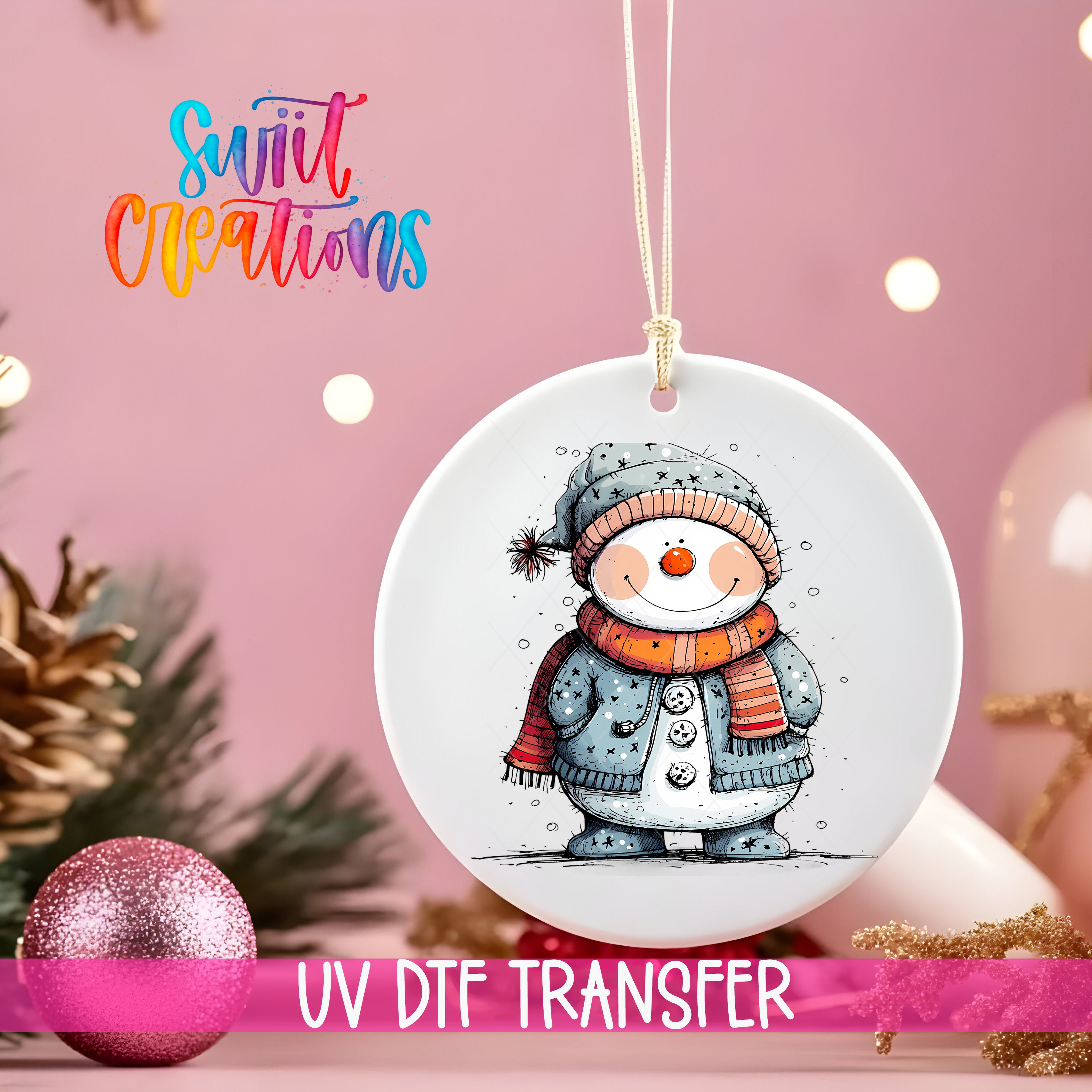 A white ceramic ornament with a snowman illustration is hanging on a string, surrounded by Christmas decorations and a pink background.