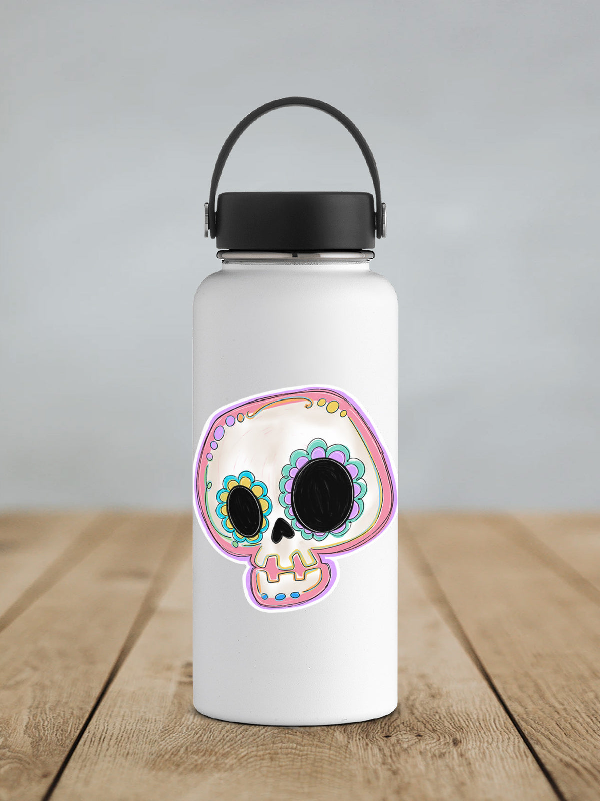 Pastel Sugar Skull sticker on a white insulated water bottle