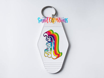 Close-up of the F*ck It UV DTF transfer on a white motel keychain