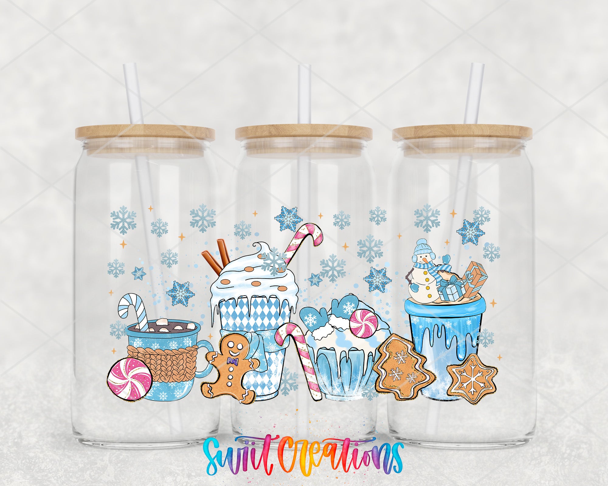 A collection of three glass tumblers with various winter-themed illustrations on them, including snowflakes, gingerbread houses, and hot chocolate mugs.