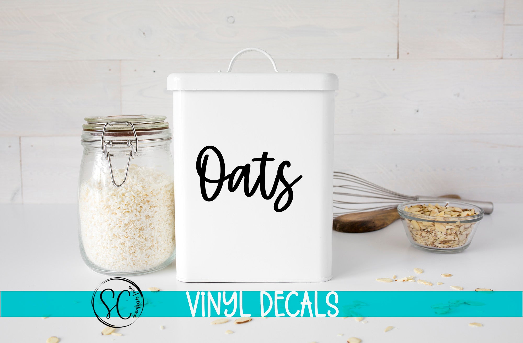 a white canister labeled "Oats" next to a glass jar filled with white grains, likely oats, and a small glass bowl containing more oats. The background is a white wooden surface with scattered oats.