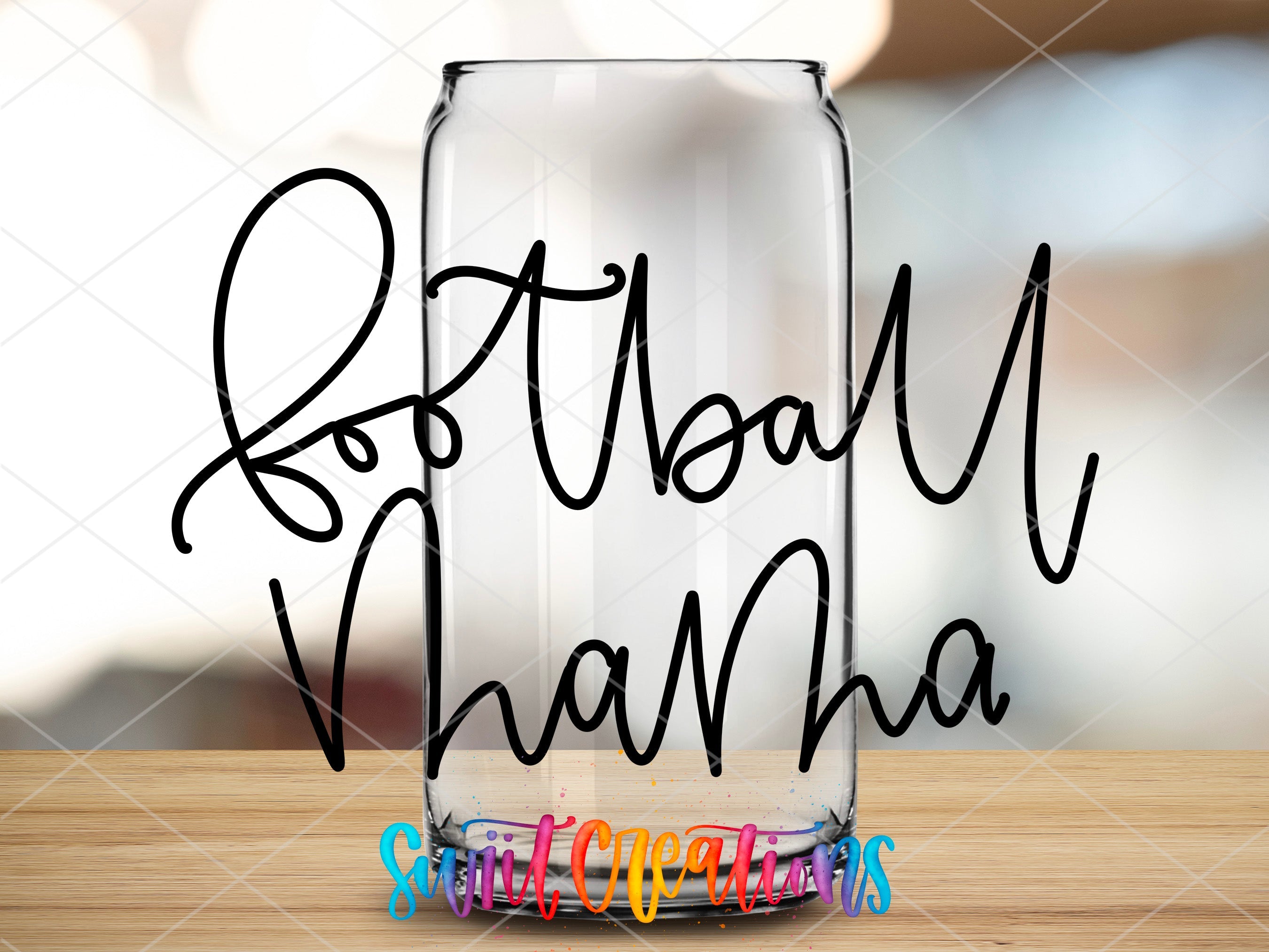 a glass with writing on it sitting on a table