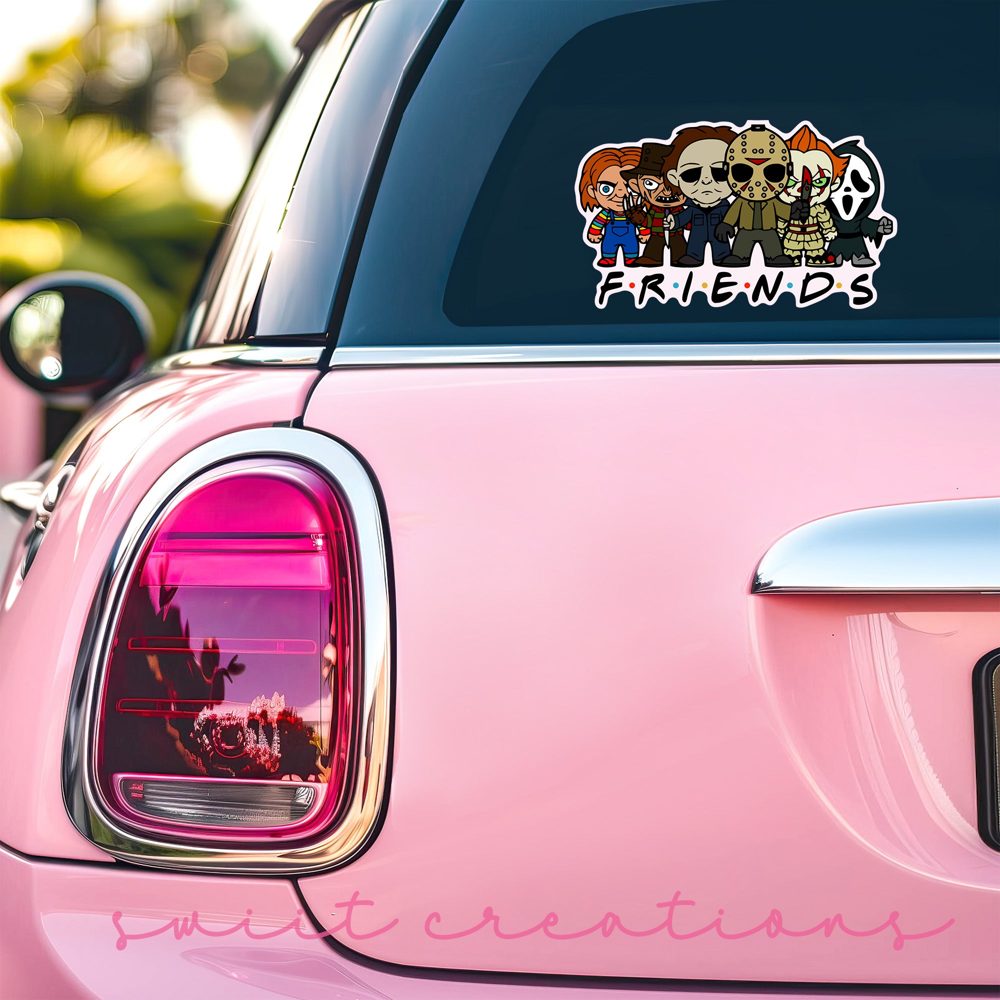 a pink car that has a sticker on it