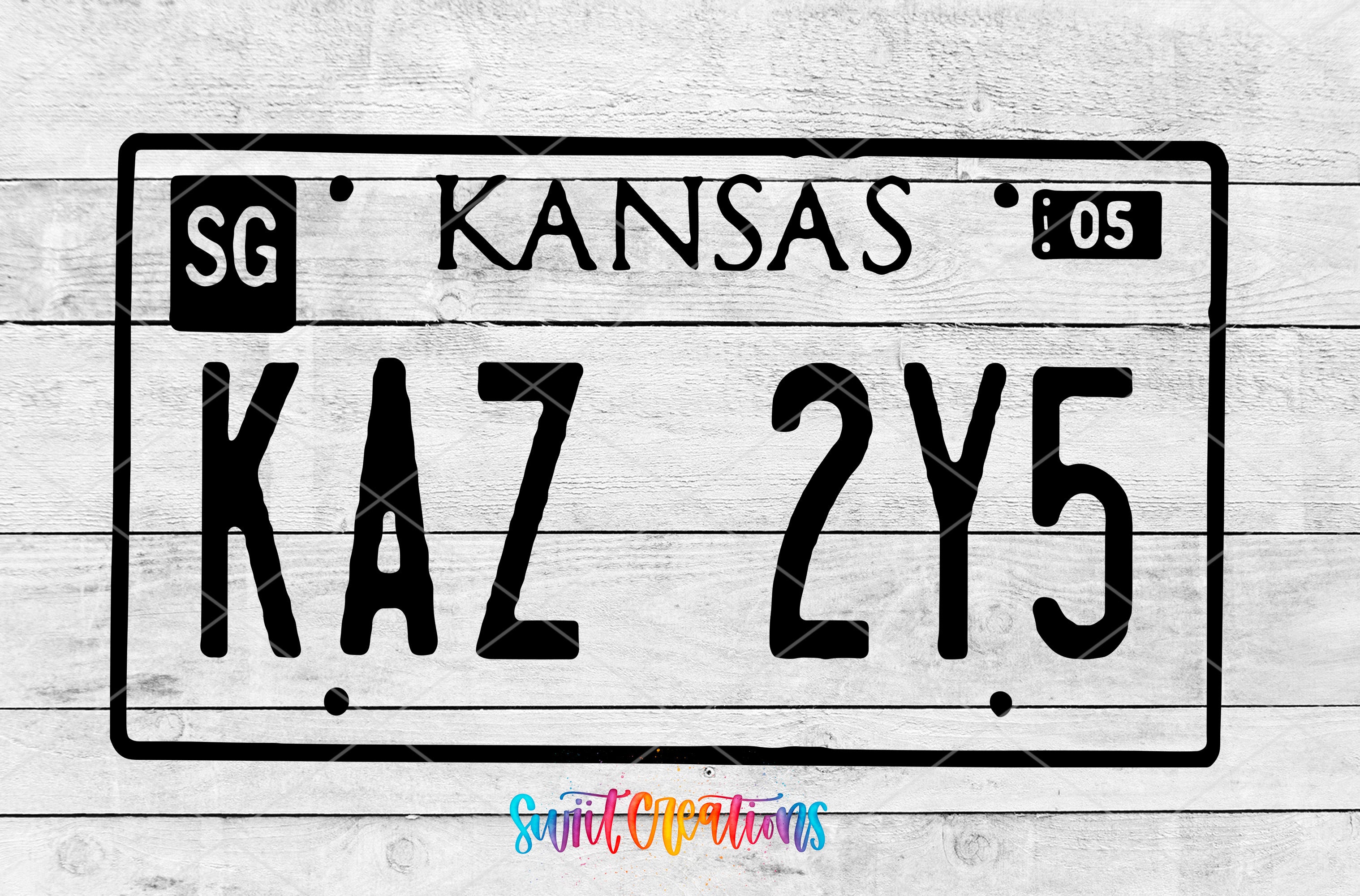 a kansas license plate on a wooden background