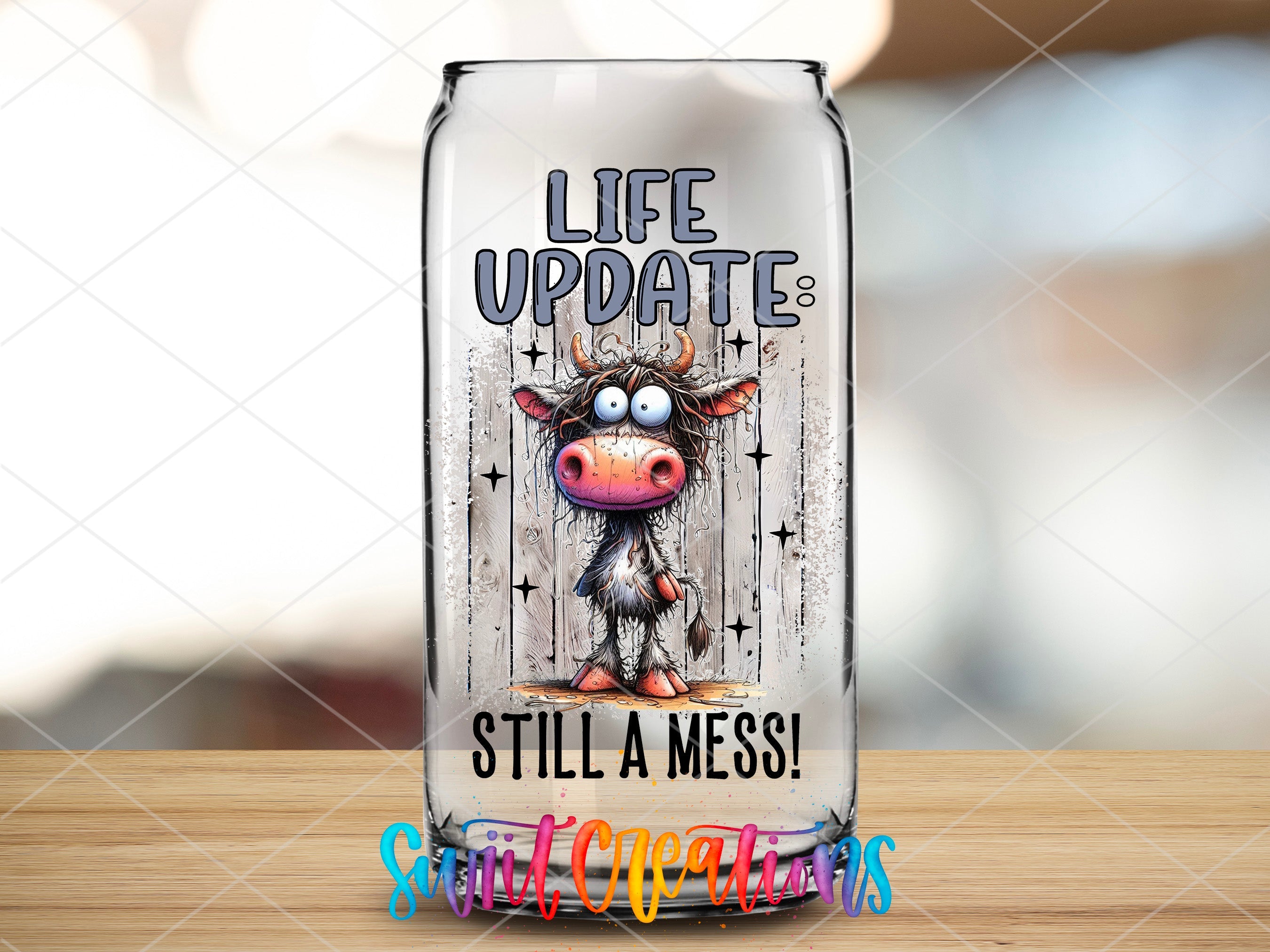 a glass jar with a cartoon cow on it