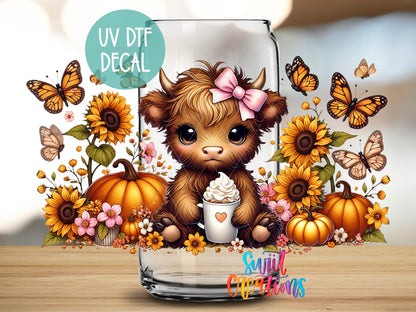 Close-up of the Fall Highland Cow UV DTF wrap on a clear glass can