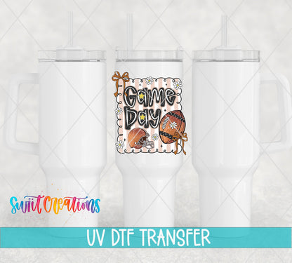 Game Day football and bows UV DTF transfer on white 40 oz tumblers