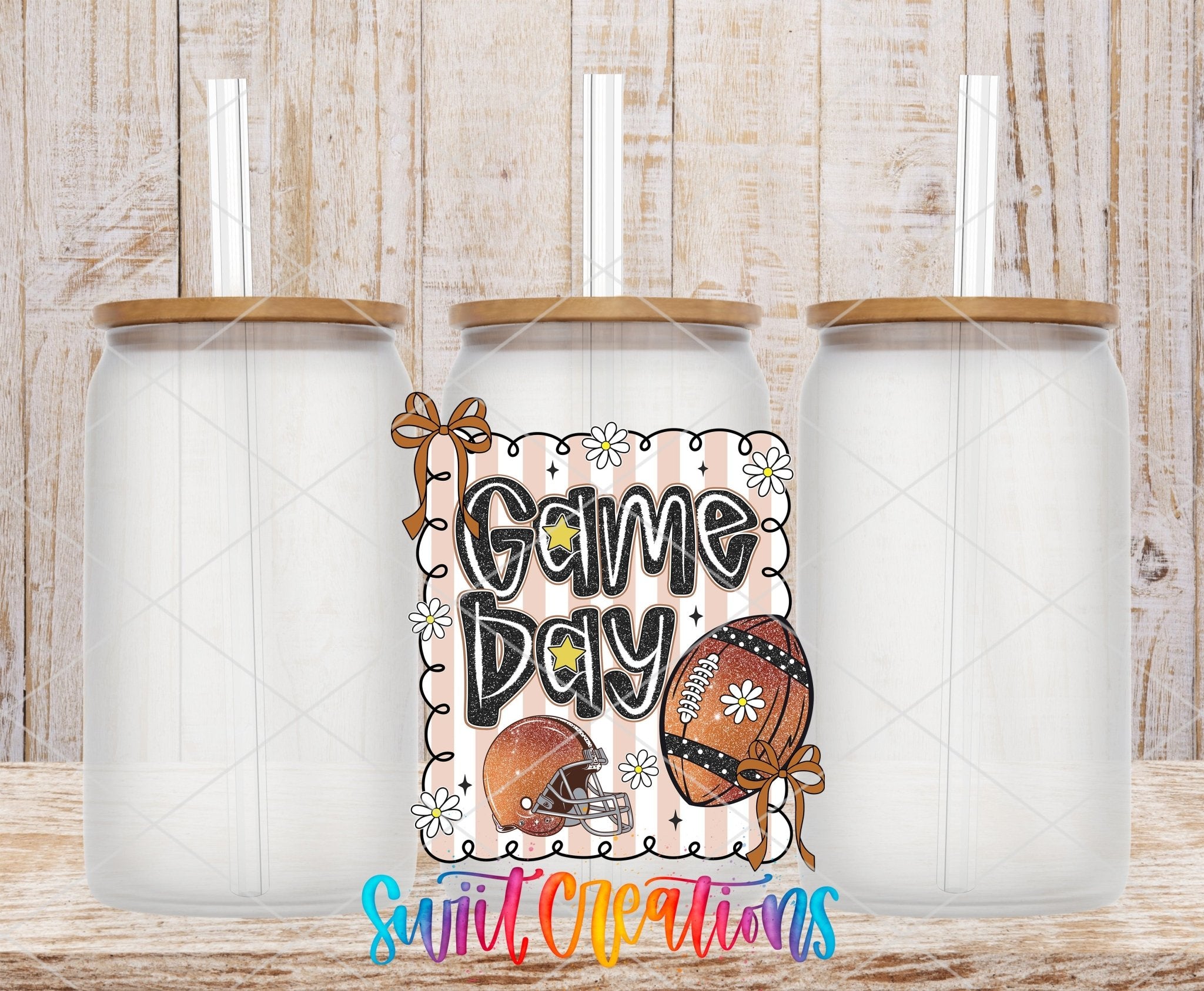 Football Game Day UV DTF transfer applied to a clear glass can set from Swiit Creations
