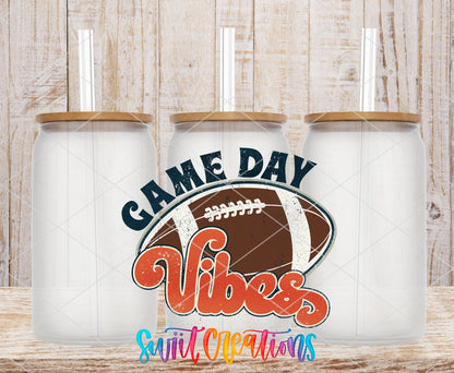 Game Day Vibes football UV DTF transfer on frosted glass cans with bamboo lids