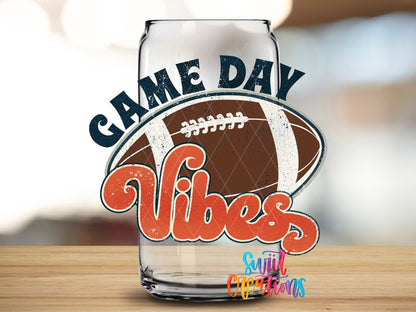 Close-up of the Game Day Vibes football UV DTF transfer on a clear glass can