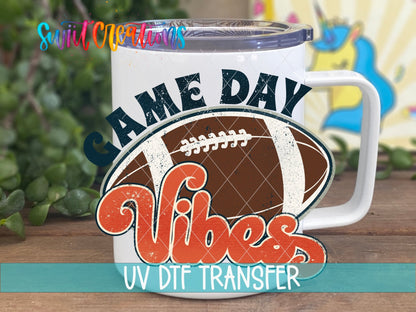 Game Day Vibes football UV DTF transfer on a white stainless steel mug with a lid