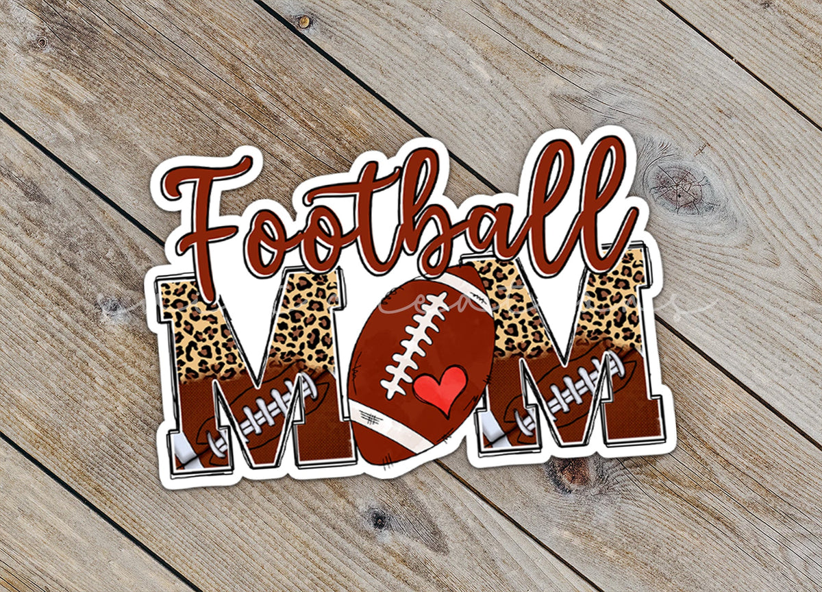 Close-up of the Football Mom sticker on rustic wood
