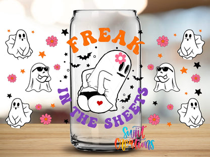 Close-up of the Freak in the Sheets UV DTF wrap on a clear glass can