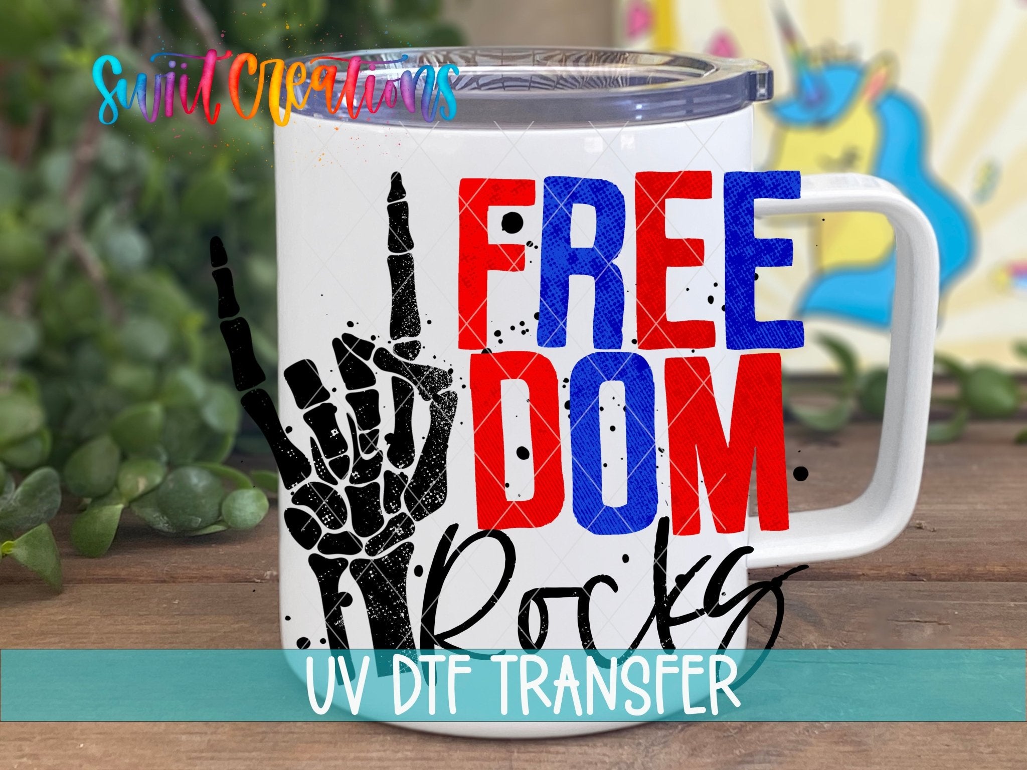 Swiit Creations Freedom Rocks UV DTF transfer displayed on a white coffee mug