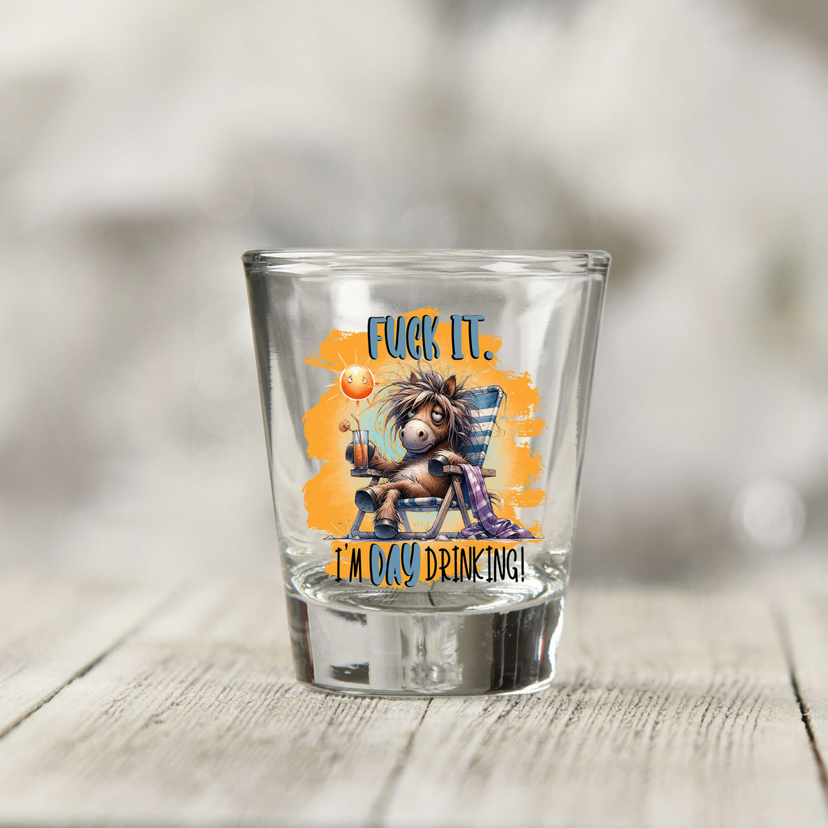 Close-up of the F*ck It I'm Day Drinking UV DTF transfer on a clear shot glass