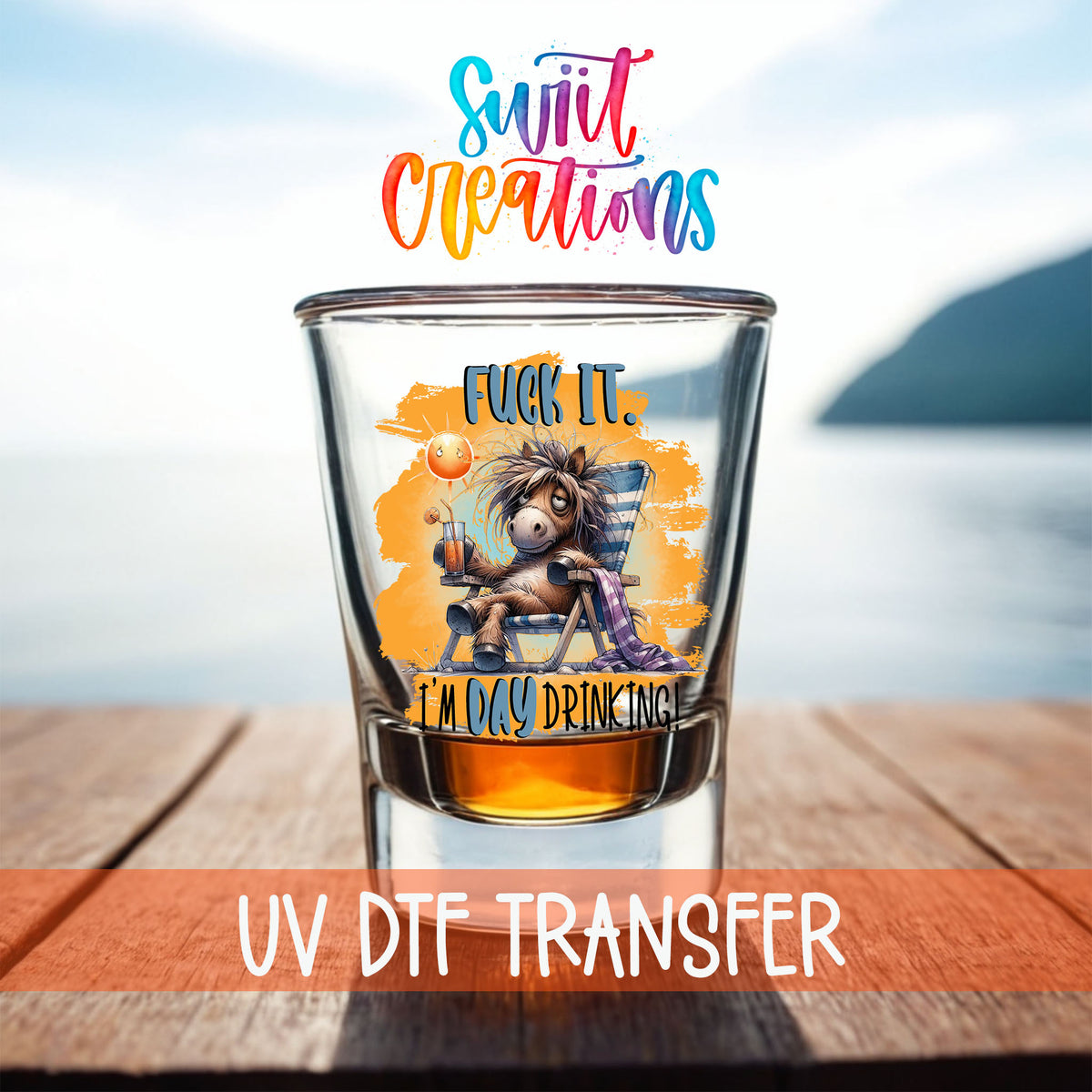 F*ck It I'm Day Drinking shot glass UV DTF transfer on a filled shot glass on a dock by the water