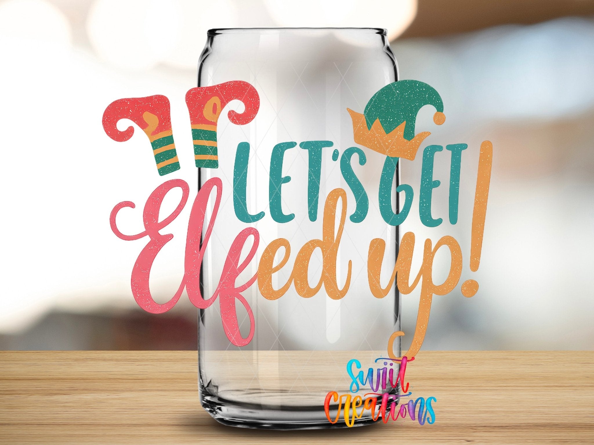 Let’s Get Elfed Up UV DTF transfer applied to a clear glass can from Swiit Creations