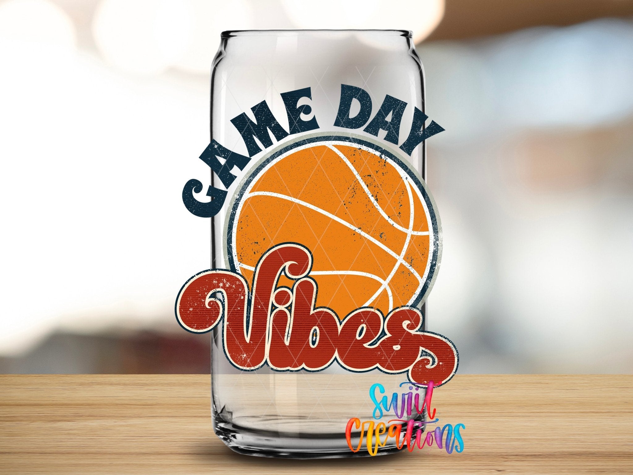 Swiit Creations Game Day Vibes Basketball UV DTF transfer shown on a clear glass can