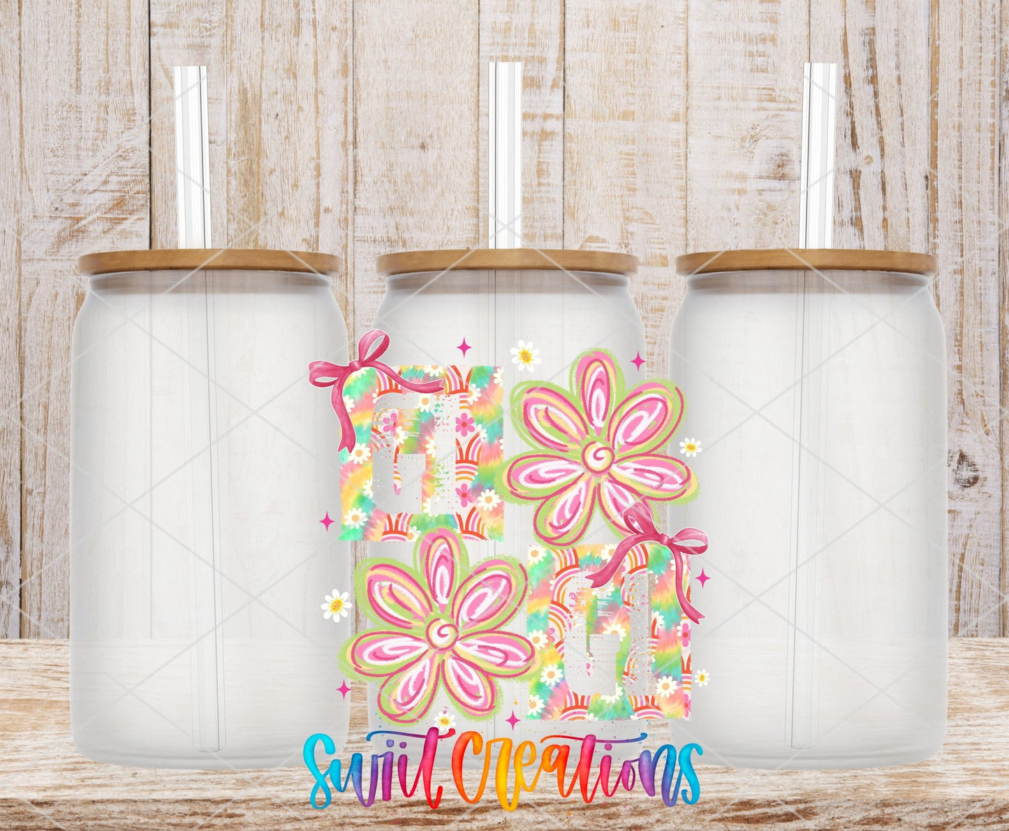 Gigi Tie Dye Flowers UV DTF transfer applied to a clear glass can set from Swiit Creations