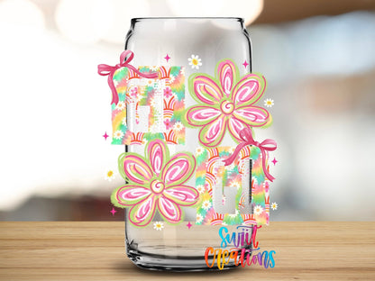 Gigi Tie Dye Flowers UV DTF transfer applied to a clear glass can from Swiit Creations